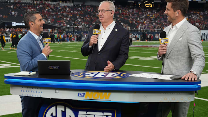 Sep 1, 2024; Paradise, Nevada, USA; SEC commissioner Greg Sankey (center) is interviewed by SEC Network anchor Dari Nowkhah (left) and analyst Jordan Rogers during the game between the LSU Tigers and the Southern California Trojans at Allegiant Stadium. Mandatory Credit: Kirby Lee-Imagn Images
