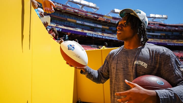 LANDOVER, MD - AUGUST 13: Jaycee Horn #8 of the Carolina Panthers interacts with fans before the preseason game against the Washington Commanders at FedExField on August 13, 2022 in Landover, Maryland. LANDOVER, MD - AUGUST 13: Jaycee Horn #8 of the Carolina Panthers interacts with fans before the preseason game against the Washington Commanders at FedExField on August 13, 2022 in Landover, Maryland.