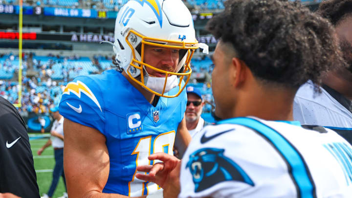 CHARLOTTE, NC - SEPTEMBER 15: Justin Herbert #10 of the Los Angeles Chargers greets Bryce Young #9 of the Carolina Panthers after a football game at Bank of America Stadium on September 15, 2024 in Charlotte, North Carolina.