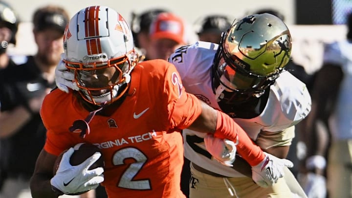 Oct 4, 2025; Blacksburg, Va.; Wake Forest safety Braylon Johnson (23) tackles Virginia Tech wide receiver Takye Heath (2).
