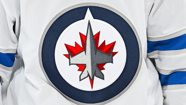 A Winnipeg Jets logo on a white jersey.