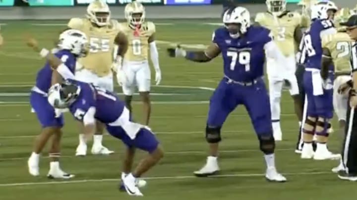 JMU quarterback Alonza Barnett III sells the flop. JMU quarterback Alonza Barnett III sells the flop.