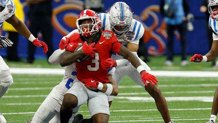 Jan 1, 2026; New Orleans, LA, USA; Georgia Bulldogs running back Nate Frazier (3) is injured while being tackled by Mississippi Rebels linebacker Tahj Chambers (26) in the fourth quarter during the 2026 Sugar Bowl and quarterfinal game of the College Football Playoff at Caesars Superdome. Mandatory Credit: Geoff Burke-Imagn Images