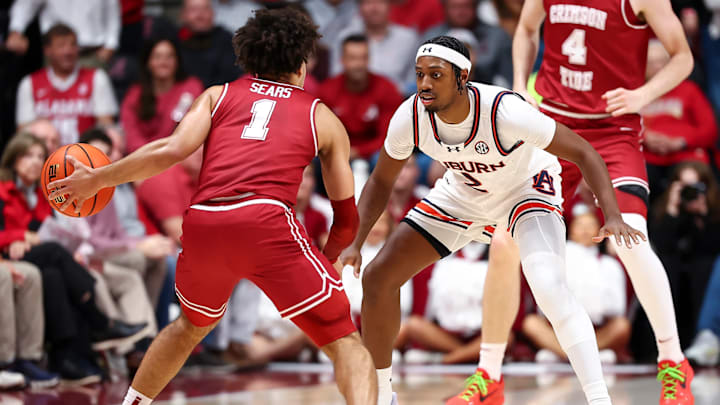 Alabama guard Mark Sears (1) vs. Auburn guard Denver Jones (2) Alabama guard Mark Sears (1) vs. Auburn guard Denver Jones (2)