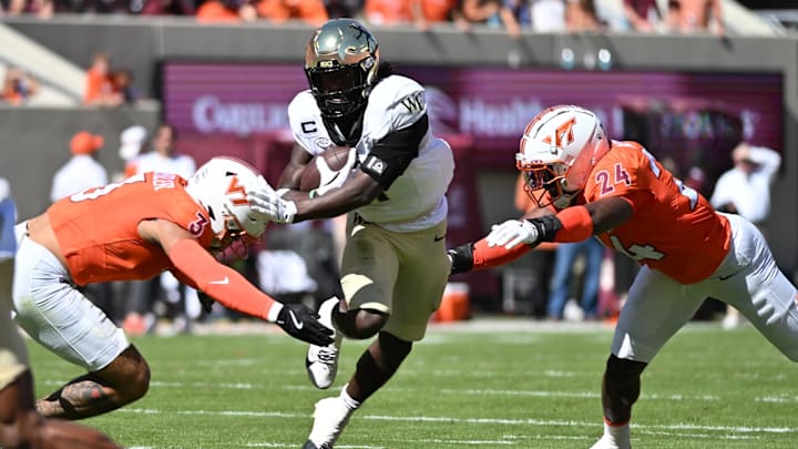 Oct 4, 2025; Blacksburg, Va.; Virginia Tech linebackers Kaleb Spencer (3) and Jaden Keller (24) prepare to tackle Wake Forest running back Demond Claiborne (1). Oct 4, 2025; Blacksburg, Va.; Virginia Tech linebackers Kaleb Spencer (3) and Jaden Keller (24) prepare to tackle Wake Forest running back Demond Claiborne (1).