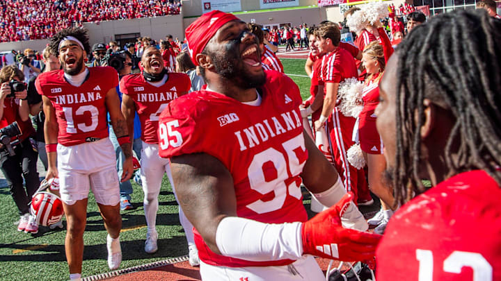 Indiana defensive lineman Tyrique Tucker (95) celebrates after defeating Washington at Memorial Stadium.
