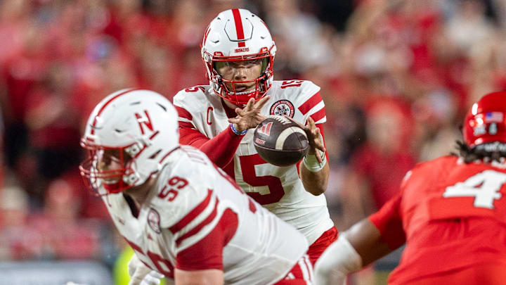 Nebraska guard Henry Lutovsky helps protect quarterback Dylan Raiola.