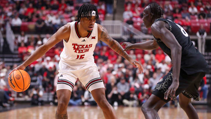 Texas Tech's JT Toppin dribbles against Colorado defender Bangot Dak during a Big 12 Conference men's basketball game, Wednesday, Feb. 11, 2026, in United Supermarkets Arena. Texas Tech's JT Toppin dribbles against Colorado defender Bangot Dak during a Big 12 Conference men's basketball game, Wednesday, Feb. 11, 2026, in United Supermarkets Arena.