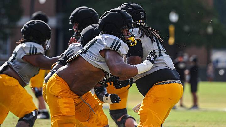 Southern Miss offensive lineman Dante Devine (54) goes through drills during fall camp. Southern Miss offensive lineman Dante Devine (54) goes through drills during fall camp.