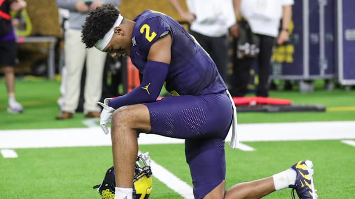 Michigan defensive back Will Johnson prays before kickoff against Washington in the national championship game at NRG Stadium in Houston on Monday, Jan. 8, 2024.