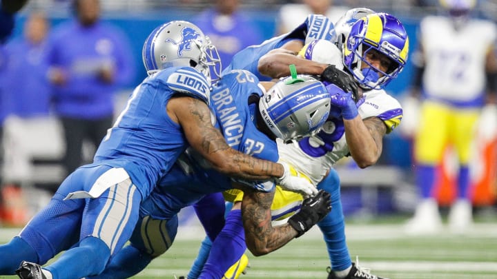 L.A. Rams running back Kyren Williams (23) is tackled by Detroit Lions safety Brian Branch (32) during the second half of the NFL wild-card playoff game at Ford Field in Detroit on Sunday, Jan, 14, 2024. L.A. Rams running back Kyren Williams (23) is tackled by Detroit Lions safety Brian Branch (32) during the second half of the NFL wild-card playoff game at Ford Field in Detroit on Sunday, Jan, 14, 2024.