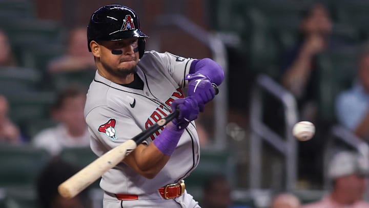 Jun 3, 2025; Atlanta, Georgia, USA; Arizona Diamondbacks catcher Gabriel Moreno (14) hits a single against the Atlanta Braves in the ninth inning at Truist Park. Mandatory Credit: Brett Davis-Imagn Images Jun 3, 2025; Atlanta, Georgia, USA; Arizona Diamondbacks catcher Gabriel Moreno (14) hits a single against the Atlanta Braves in the ninth inning at Truist Park. Mandatory Credit: Brett Davis-Imagn Images