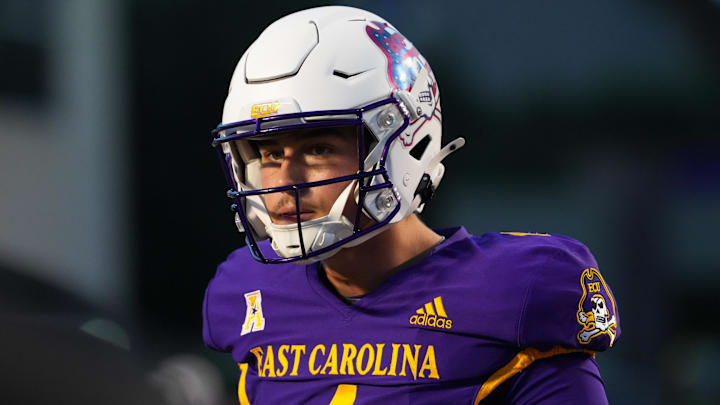 Sep 25, 2025; Greenville, North Carolina, USA;  East Carolina Pirates quarterback Katin Houser (4) looks on during the warmups before the game against the Army Black Knights at Dowdy-Ficklen Stadium. Mandatory Credit: James Guillory-Imagn Images