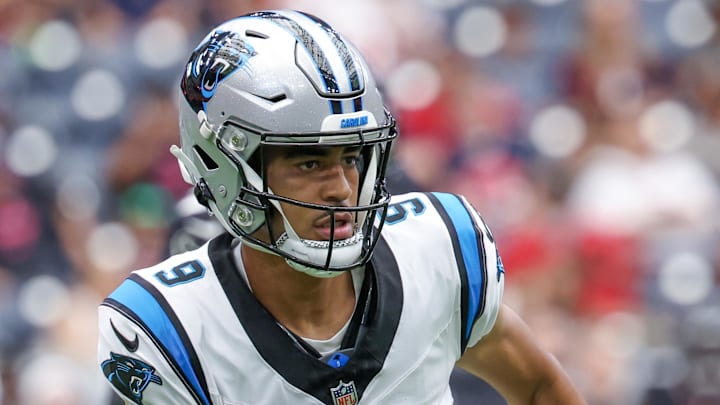 Aug 16, 2025; Houston, Texas, USA; Carolina Panthers quarterback Bryce Young (9) rushes against the Houston Texans in the first quarter at NRG Stadium. Mandatory Credit: Thomas Shea-Imagn Images
