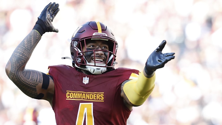 Nov 24, 2024; Landover, Maryland, USA; Washington Commanders linebacker Frankie Luvu (4) celebrates after making a play Dallas Cowboys during the second quarter at Northwest Stadium. Mandatory Credit: Geoff Burke-Imagn Images