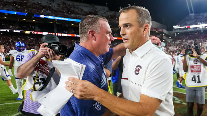 Sep 3, 2022; Columbia, South Carolina, USA; South Carolina Gamecocks head coach Shane Beamer and Georgia State Panthers head coach Shawn Elliott speak following their game at Williams-Brice Stadium. Mandatory Credit: Jeff Blake-Imagn Images