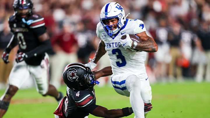 Kentucky Wildcats running back Seth McGowan (3) gets past South Carolina Gamecocks defensive back Vicari Swain (4) on his way to a touchdown in the first quarter at Williams-Brice Stadium.