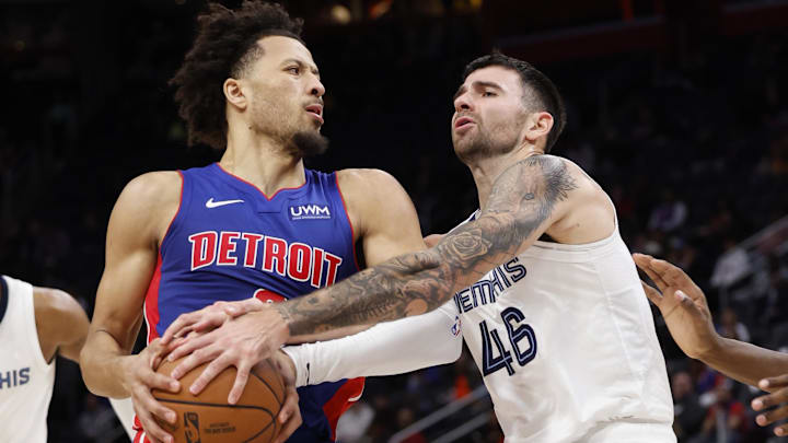 Dec 6, 2023; Detroit, Michigan, USA;  Memphis Grizzlies guard John Konchar (46) strips the ball from