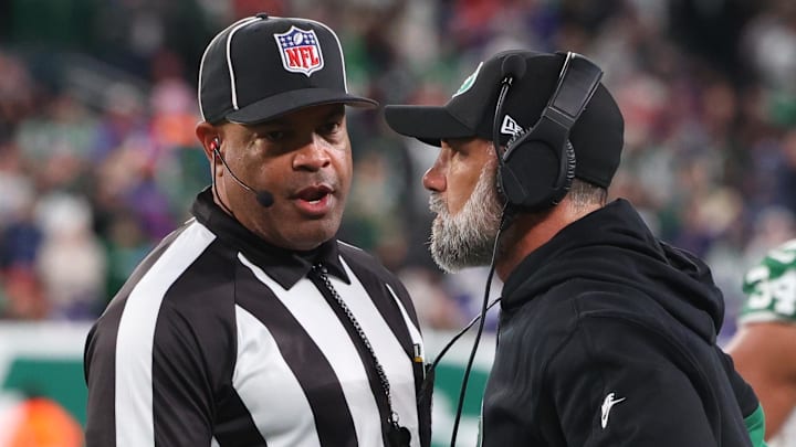 Jets interim head coach Jeff Ulbrich speaks with a referee during the second half.