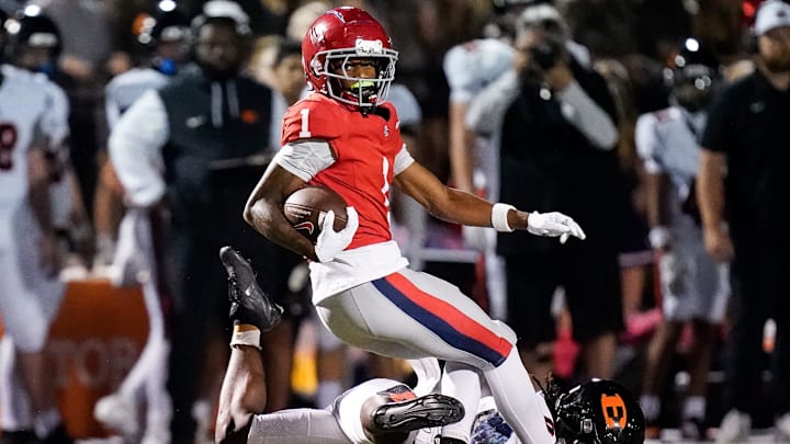 Brentwood Academy's Kesean Bowman (1) evades Ensworth's Bishop Starling (0) during the first quarter at Brentwood Academy in Brentwood, Tenn., Friday, Sept. 26, 2025.