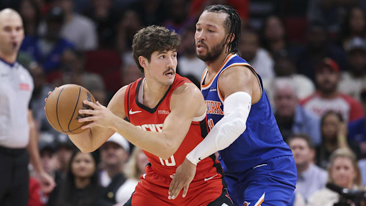 Nov 4, 2024; Houston, Texas, USA; Houston Rockets guard Reed Sheppard (15) controls the ball as New York Knicks guard Jalen Brunson (11) defends during the second half at Toyota Center. Mandatory Credit: Troy Taormina-Imagn Images