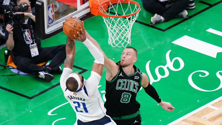 Jun 9, 2024; Boston, Massachusetts, USA; Boston Celtics center Kristaps Porzingis (8) blocks Dallas Mavericks center Daniel Gafford (21) in the third quarter during game two of the 2024 NBA Finals at TD Garden. Mandatory Credit: David Butler II-USA TODAY Sports Jun 9, 2024; Boston, Massachusetts, USA; Boston Celtics center Kristaps Porzingis (8) blocks Dallas Mavericks center Daniel Gafford (21) in the third quarter during game two of the 2024 NBA Finals at TD Garden. Mandatory Credit: David Butler II-USA TODAY Sports