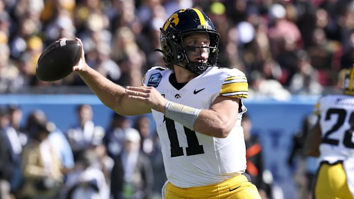 Dec 31, 2025; Tampa, FL, USA; Iowa Hawkeyes quarterback Mark Gronowski (11) throws a pass against the Vanderbilt Commodores in the first quarter during the ReliaQuest Bowl at Raymond James Stadium. Mandatory Credit: Nathan Ray Seebeck-Imagn Images Dec 31, 2025; Tampa, FL, USA; Iowa Hawkeyes quarterback Mark Gronowski (11) throws a pass against the Vanderbilt Commodores in the first quarter during the ReliaQuest Bowl at Raymond James Stadium. Mandatory Credit: Nathan Ray Seebeck-Imagn Images