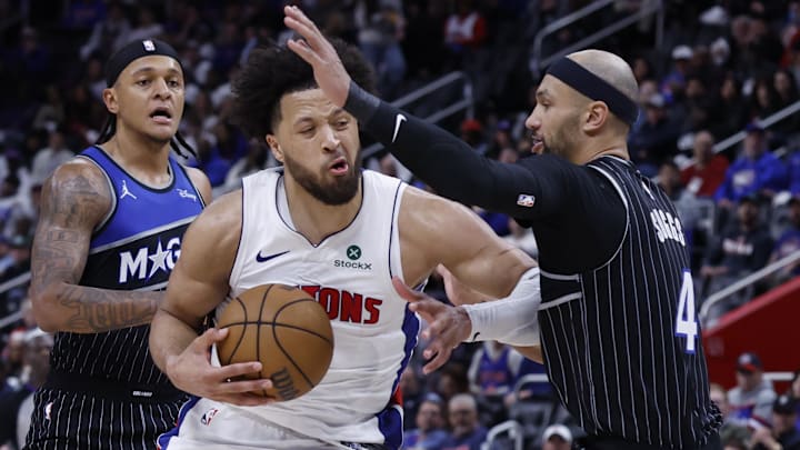 Apr 19, 2026; Detroit, Michigan, USA; Detroit Pistons guard Cade Cunningham (2) is defended by Orlando Magic guard Jalen Suggs (4) in the second half during the 2026 NBA Playoffs at Little Caesars Arena. Mandatory Credit: Rick Osentoski-Imagn Images