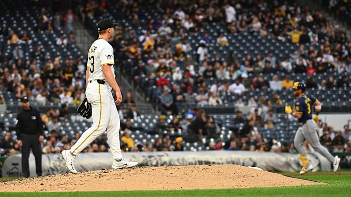 Pittsburgh Pirates starting pitcher Mitch Keller watches Jake Bauers trot around the bases after a home run.