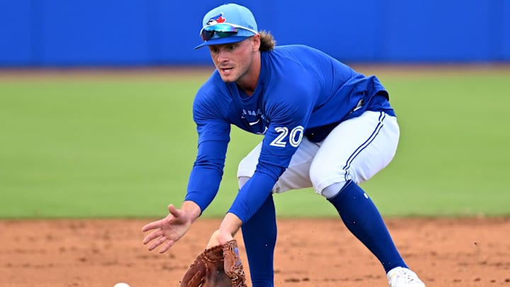 Feb 19, 2026; Dunedin, FL, USA;] Toronto Blue Jays infielder Ben Cowles (20) fields a ground ball during spring training at Bobby Mattick Training Center at Englebert Complex. Mandatory Credit: Jonathan Dyer-Imagn Images