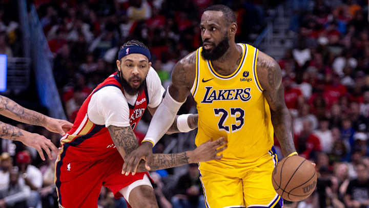 Apr 16, 2024; New Orleans, Louisiana, USA; Los Angeles Lakers forward LeBron James (23) dribbles against New Orleans Pelicans forward Brandon Ingram (14) during the second half of a play-in game of the 2024 NBA playoffs at Smoothie King Center. Apr 16, 2024; New Orleans, Louisiana, USA; Los Angeles Lakers forward LeBron James (23) dribbles against New Orleans Pelicans forward Brandon Ingram (14) during the second half of a play-in game of the 2024 NBA playoffs at Smoothie King Center.