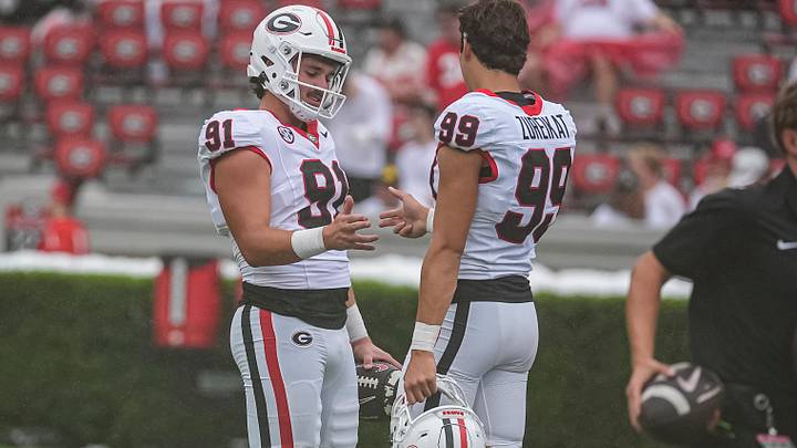 Sep 12, 2026; Athens, Georgia, USA; Georgia Bulldogs kicker Peyton Woodring (91) reacts with kicker Harran Zureikat (99) on the field prior to the game against the Western Kentucky Hilltoppers at Sanford Stadium. Mandatory Credit: Dale Zanine-Imagn Images