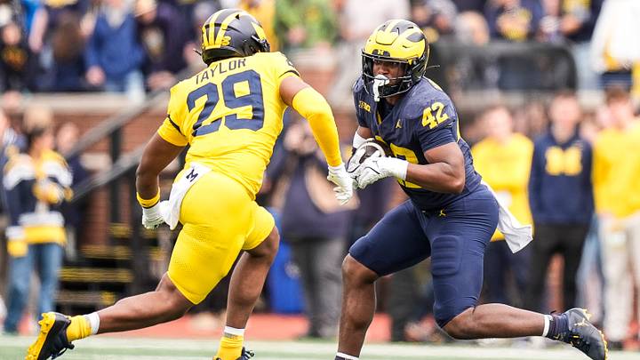 Team Blue tight end Jalen Hoffman (42) makes a catch against Team Maize linebacker Chase Taylor (29) during the first half of the spring game at Michigan Stadium in Ann Arbor on Saturday, April 19, 2025. Team Blue tight end Jalen Hoffman (42) makes a catch against Team Maize linebacker Chase Taylor (29) during the first half of the spring game at Michigan Stadium in Ann Arbor on Saturday, April 19, 2025.