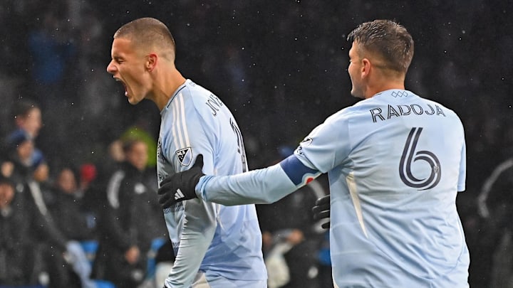 Mar 15, 2025; Kansas City, Kansas, USA;  Sporting Kansas City forward Dejan Joveljic (9) reacts after scoring a goal against Minnesota United in the second half at Children's Mercy Park. Mandatory Credit: Peter Aiken-Imagn Images