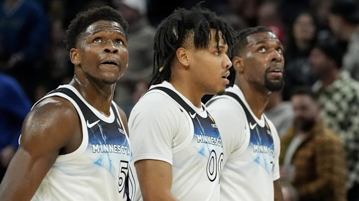 Minnesota Timberwolves guards Anthony Edwards (5) and Terrence Shannon Jr. (00) and center Naz Reid walk off the court for a timeout in the first quarter of the game with the Oklahoma City Thunder at Target Center in Minneapolis on Feb. 13, 2025.