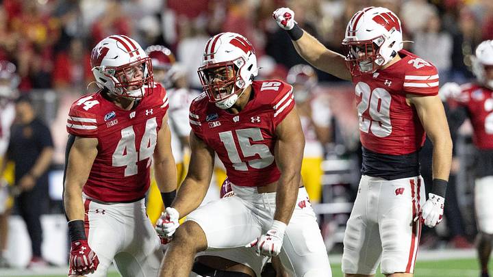 Oct 24, 2026; Madison, Wisconsin, USA;  Wisconsin Badgers outside linebacker Sebastian Cheeks (15) and linebacker Cooper Catalano (44) celebrate after tackling USC Trojans running back King Miller (8) as Wisconsin safety Matt Jung (29) joins the celebration during the first half at Camp Randall Stadium.  Mandatory Credit: Anthony Wahl-Imagn Images