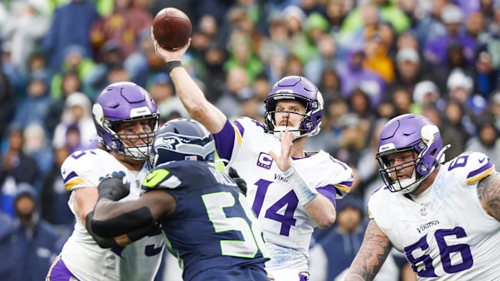Minnesota Vikings quarterback Sam Darnold throws a touchdown pass against the Seattle Seahawks during the second quarter at Lumen Field in Seattle on Dec. 22, 2024.
