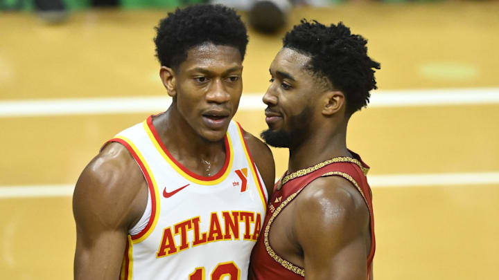 Nov 28, 2023; Cleveland, Ohio, USA; Cleveland Cavaliers guard Donovan Mitchell (45) reacts beside Atlanta Hawks forward De'Andre Hunter (12) in the fourth quarter at Rocket Mortgage FieldHouse. Mandatory Credit: David Richard-Imagn Images Nov 28, 2023; Cleveland, Ohio, USA; Cleveland Cavaliers guard Donovan Mitchell (45) reacts beside Atlanta Hawks forward De'Andre Hunter (12) in the fourth quarter at Rocket Mortgage FieldHouse. Mandatory Credit: David Richard-Imagn Images