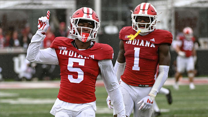 Indiana Hoosiers defensive backs D'Angelo Ponds (5) and Shawn Asbury II (1) celebrate an incompletion against Maryland at Memorial Stadium. 