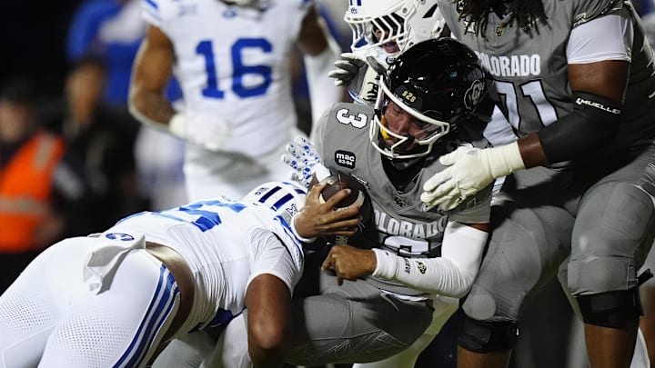 Sep 27, 2025; Boulder, Colorado, USA; Colorado Buffaloes quarterback Kaidon Salter (3) scores a touchdown past Brigham Young Cougars defensive end Viliami Po'uha (45) in the first quarter at Folsom Field. Mandatory Credit: Ron Chenoy-Imagn Images