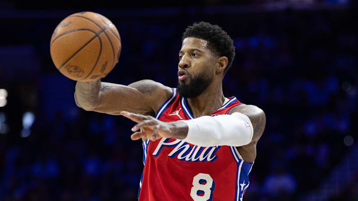 Jan 24, 2025; Philadelphia, Pennsylvania, USA; Philadelphia 76ers forward Paul George (8) passes the ball against the Cleveland Cavaliers during the second quarter at Wells Fargo Center. Mandatory Credit: Bill Streicher-Imagn Images
