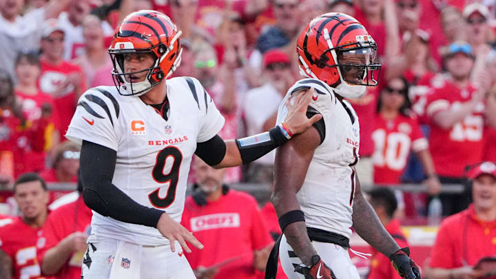 Sep 15, 2024; Kansas City, Missouri, USA; Cincinnati Bengals quarterback Joe Burrow (9) restrains wide receiver Ja'Marr Chase (1) after an altercation with officials during the second half of the game against the Kansas City Chiefs at GEHA Field at Arrowhead Stadium. Mandatory Credit: Denny Medley-Imagn Images
