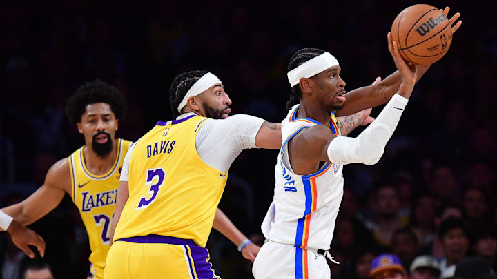 Mar 4, 2024; Los Angeles, California, USA; Oklahoma City Thunder guard Shai Gilgeous-Alexander (2) passes the ball ahead of Los Angeles Lakers forward Anthony Davis (3) during the first half at Crypto.com Arena. Mandatory Credit: Gary A. Vasquez-Imagn Images Mar 4, 2024; Los Angeles, California, USA; Oklahoma City Thunder guard Shai Gilgeous-Alexander (2) passes the ball ahead of Los Angeles Lakers forward Anthony Davis (3) during the first half at Crypto.com Arena. Mandatory Credit: Gary A. Vasquez-Imagn Images