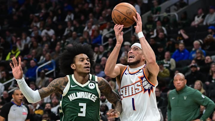 Apr 1, 2025; Milwaukee, Wisconsin, USA; Phoenix Suns guard Devin Booker (1) looks for a shot against Milwaukee Bucks guard Kevin Porter (3) in the second quarter at Fiserv Forum. Mandatory Credit: Benny Sieu-Imagn Images Apr 1, 2025; Milwaukee, Wisconsin, USA; Phoenix Suns guard Devin Booker (1) looks for a shot against Milwaukee Bucks guard Kevin Porter (3) in the second quarter at Fiserv Forum. Mandatory Credit: Benny Sieu-Imagn Images