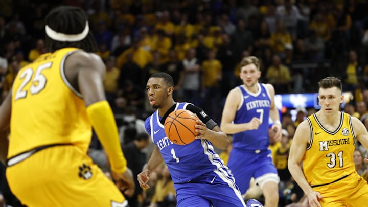 Mar 8, 2025; Columbia, Missouri, USA; Kentucky Wildcats guard Lamont Butler (1) with the ball down the court between Missouri Tigers guard Mark Mitchell (25) and Missouri Tigers guard Caleb Grill (31) in the second half at Mizzou Arena. Mandatory Credit: Gary Rohman-Imagn Images