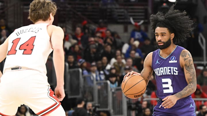 Feb 24, 2026; Chicago, Illinois, USA; Charlotte Hornets guard Coby White (3) dribbles against Chicago Bulls forward Matas Buzelis (14) during the first half at United Center. Mandatory Credit: Matt Marton-Imagn Images