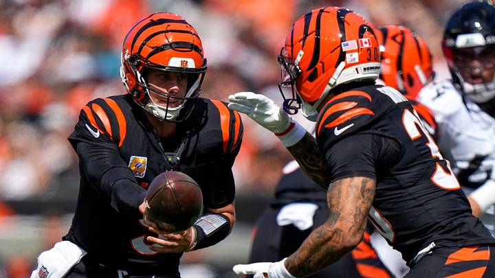 Cincinnati Bengals quarterback Joe Burrow (9) hands off to running back Chase Brown (30) in the first quarter of the NFL Week 4 game between the Cincinnati Bengals and the Jacksonville Jaguars at Paycor Stadium in Cincinnati on Sunday, Oct. 4, 2026. Cincinnati Bengals quarterback Joe Burrow (9) hands off to running back Chase Brown (30) in the first quarter of the NFL Week 4 game between the Cincinnati Bengals and the Jacksonville Jaguars at Paycor Stadium in Cincinnati on Sunday, Oct. 4, 2026.