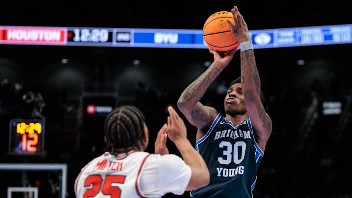 Mar 12, 2026; Kansas City, MO, USA; BYU Cougars forward Kennard Davis Jr. (30) shoots the ball over Houston Cougars guard Mercy Miller (25) during the second half at T-Mobile Center. Mandatory Credit: William Purnell-Imagn Images