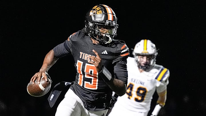 Belleville quarterback Bryce Underwood keeps the ball and runs against Saline during the second half of district final at Belleville High School in Belleville on Friday, Nov. 8, 2024. Belleville quarterback Bryce Underwood keeps the ball and runs against Saline during the second half of district final at Belleville High School in Belleville on Friday, Nov. 8, 2024.