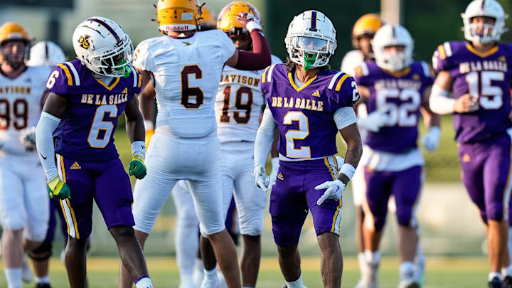 Warren De La Salle wide receiver Damion King IV, center, celebrates a first down against Davison during first half of Prep Kickoff Classic at Wayne State's Tom Adams Field in Detroit on Thursday, August 29, 2024.